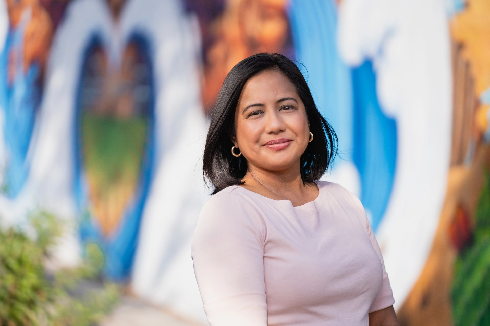 Photo of Councilmember Jurado in front of a mural